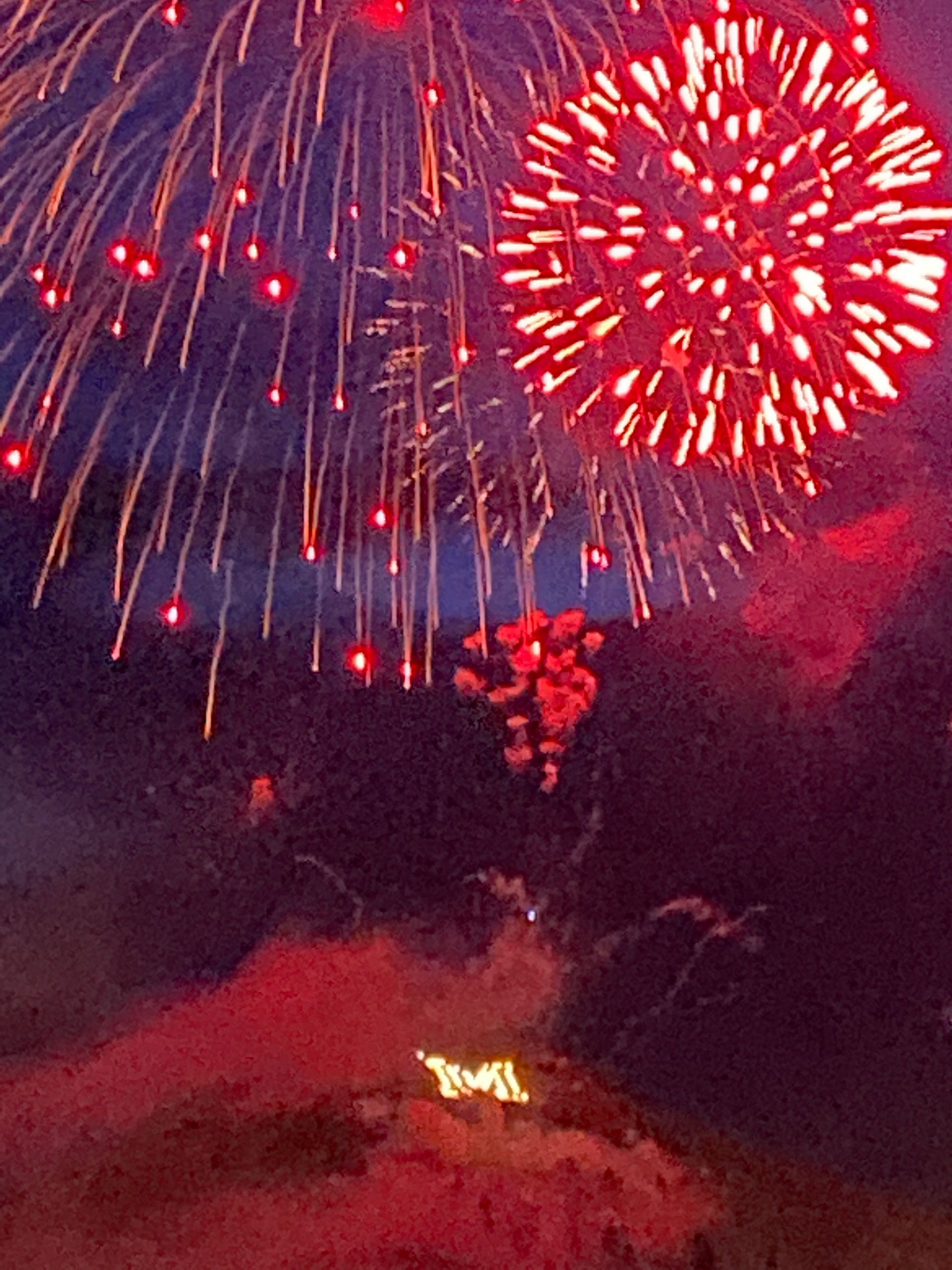 Fireworks exploding in the night sky over  Butte, MT
