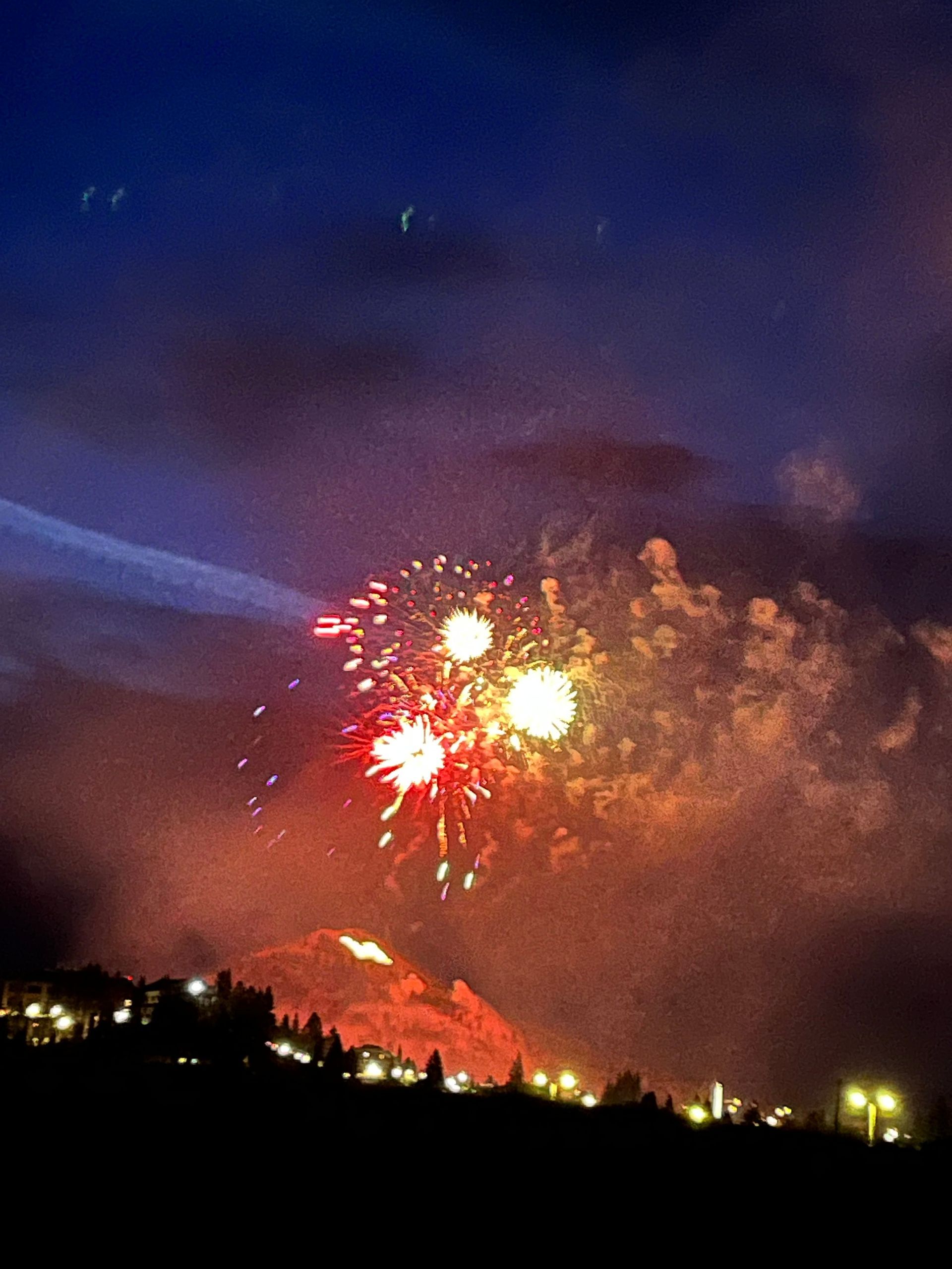 Fireworks exploding in the night sky over  Butte, MT