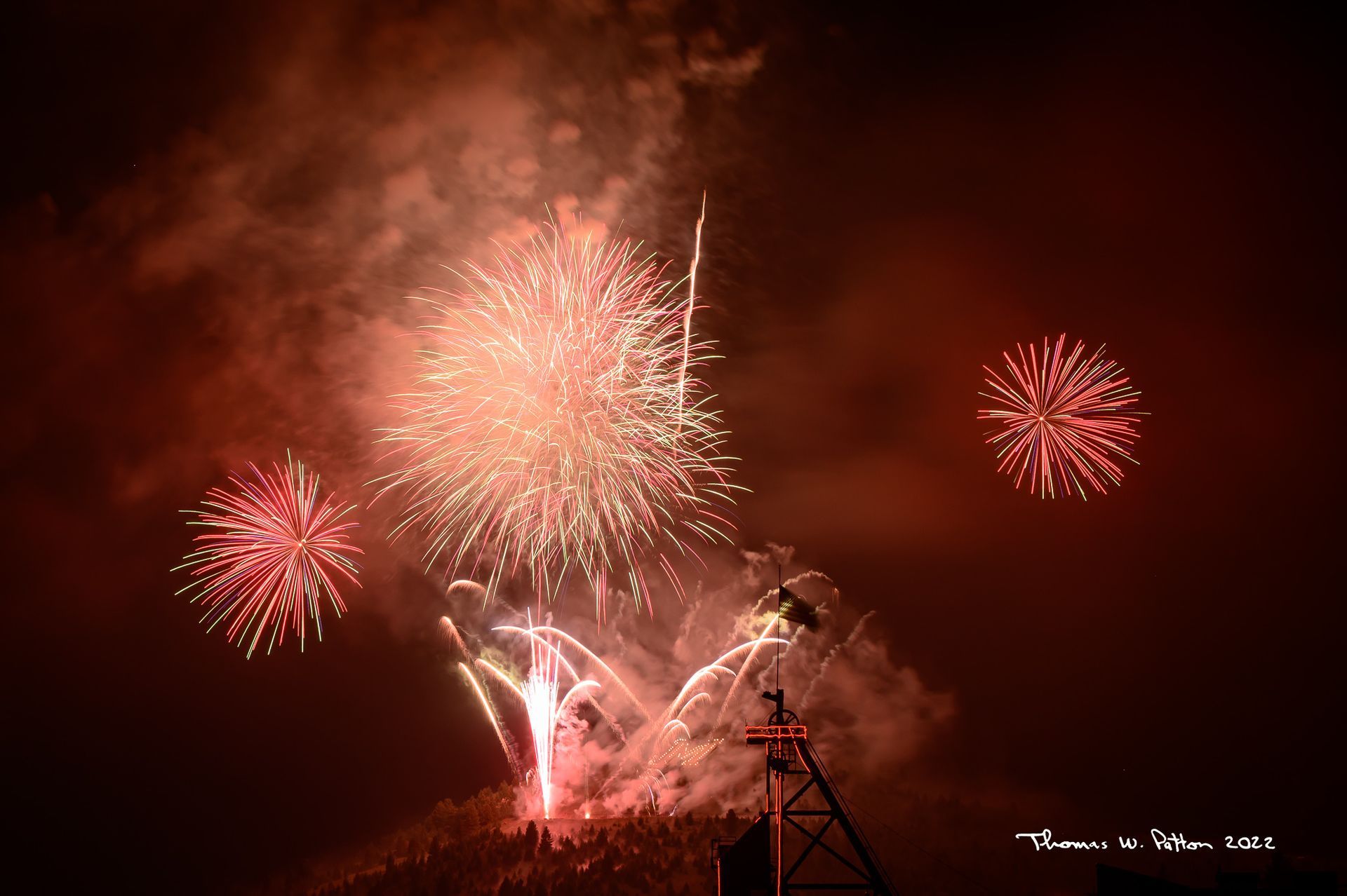 Fireworks exploding in the night sky over  Butte, MT