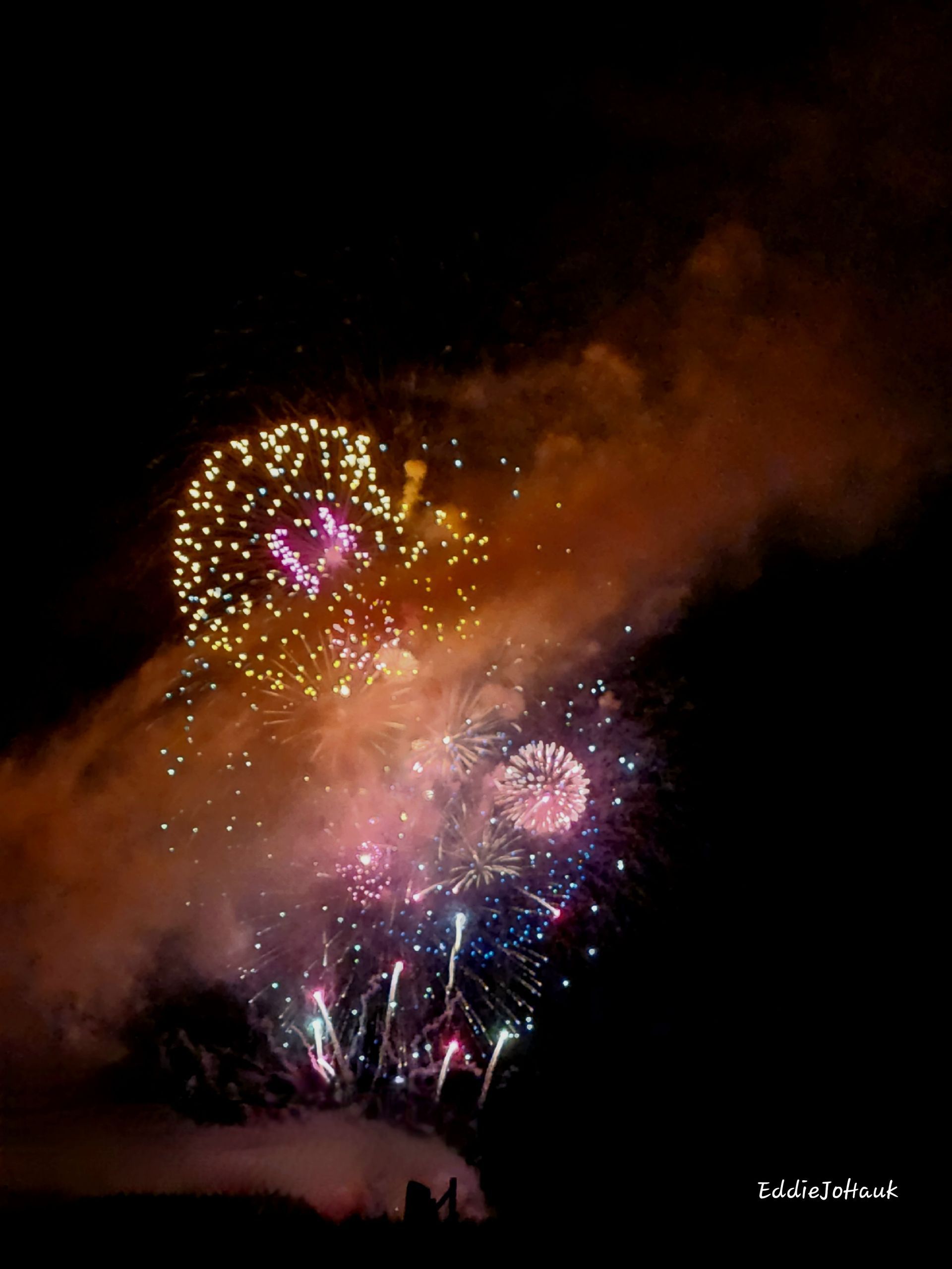 Fireworks exploding in the night sky over  Butte, MT