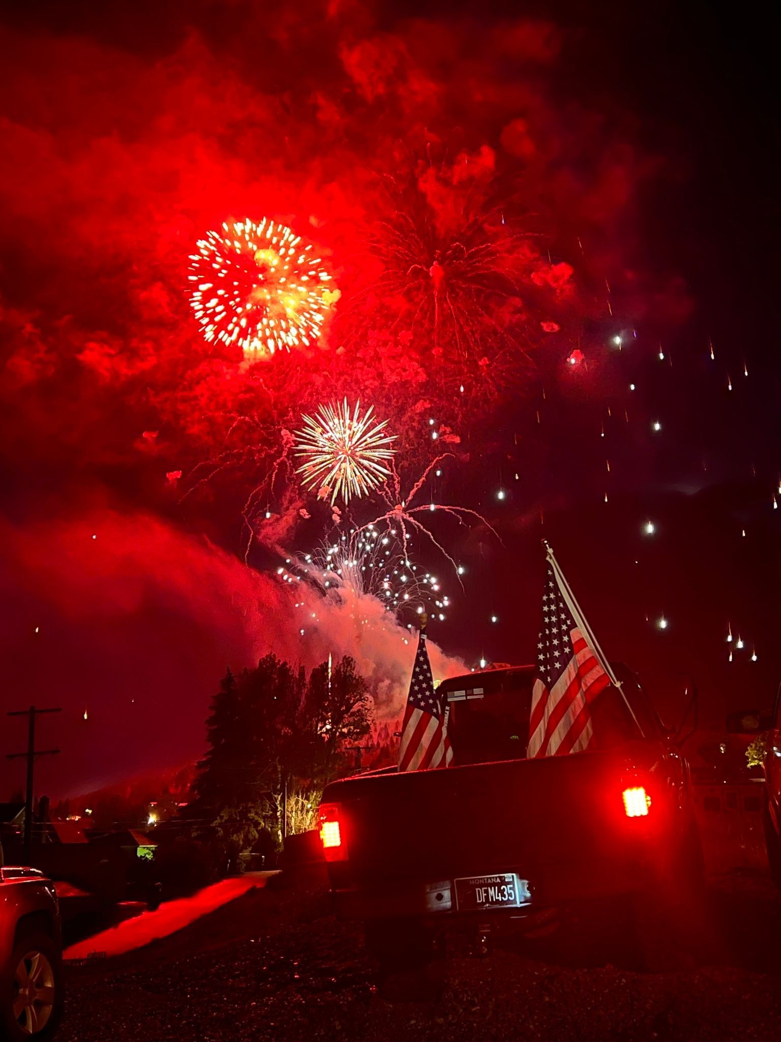 Fireworks exploding in the night sky over  Butte, MT