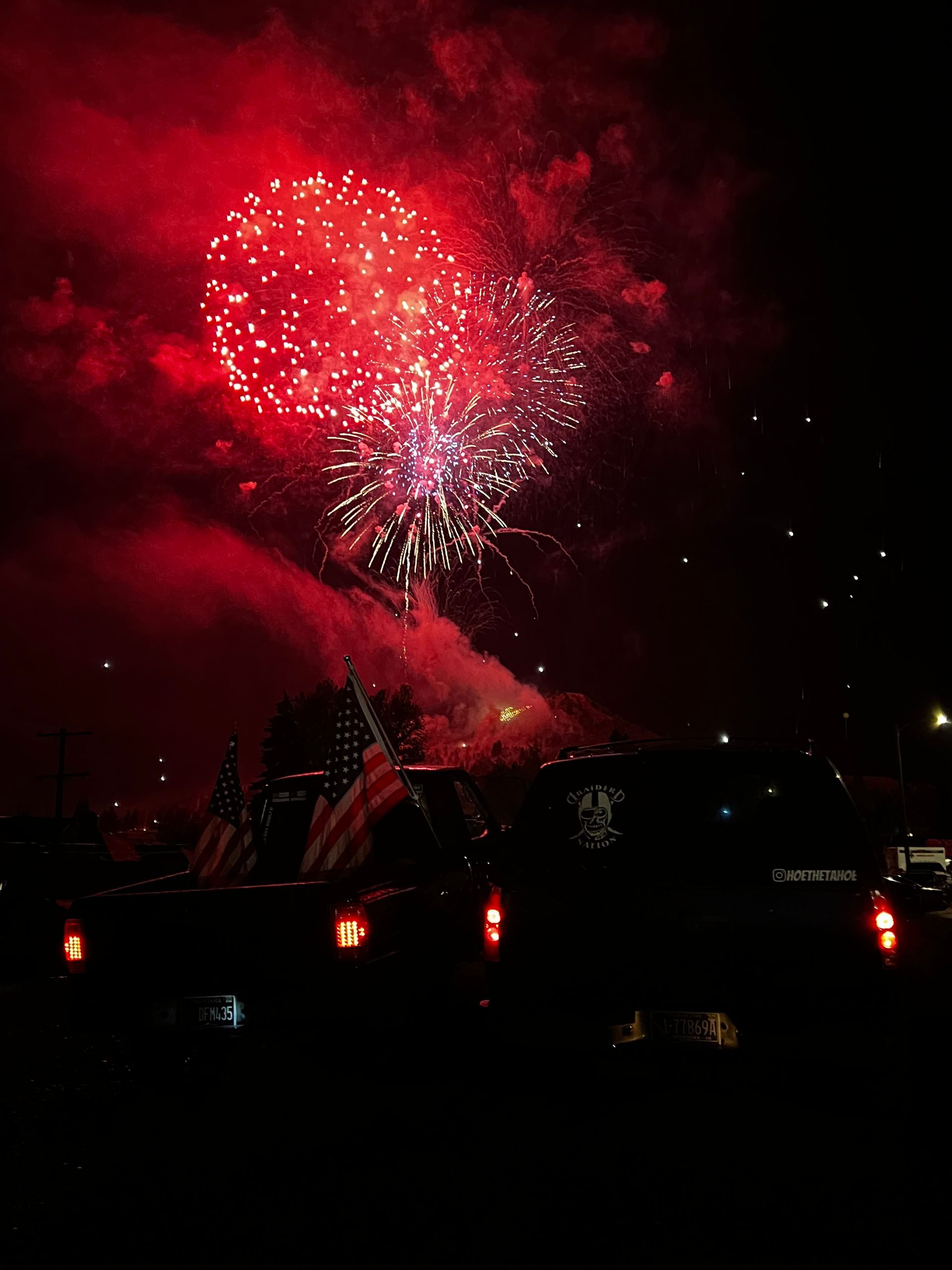 Fireworks exploding in the night sky over  Butte, MT