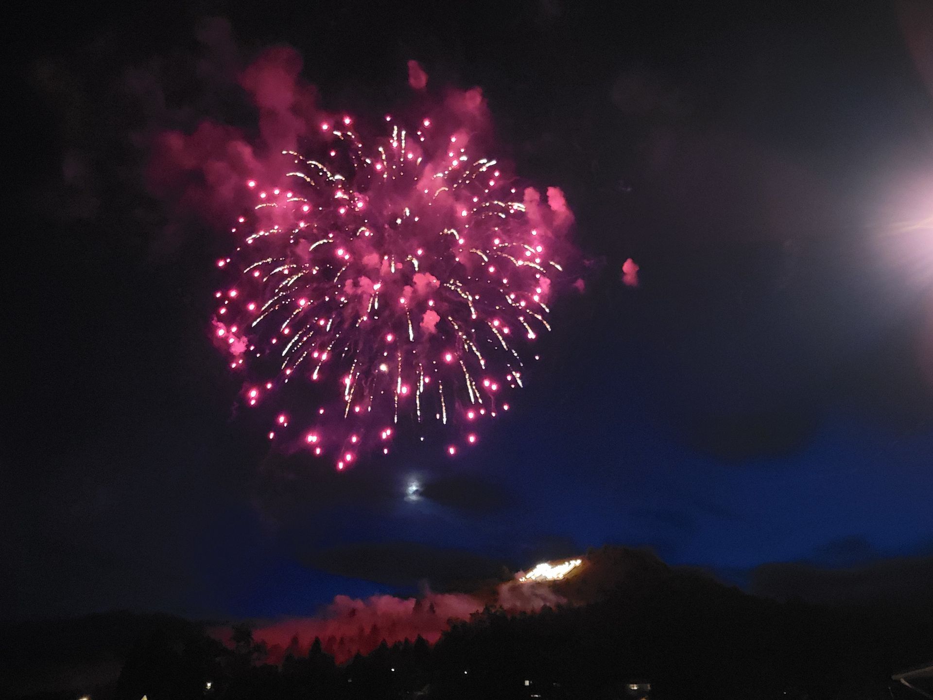 Fireworks exploding in the night sky over  Butte, MT