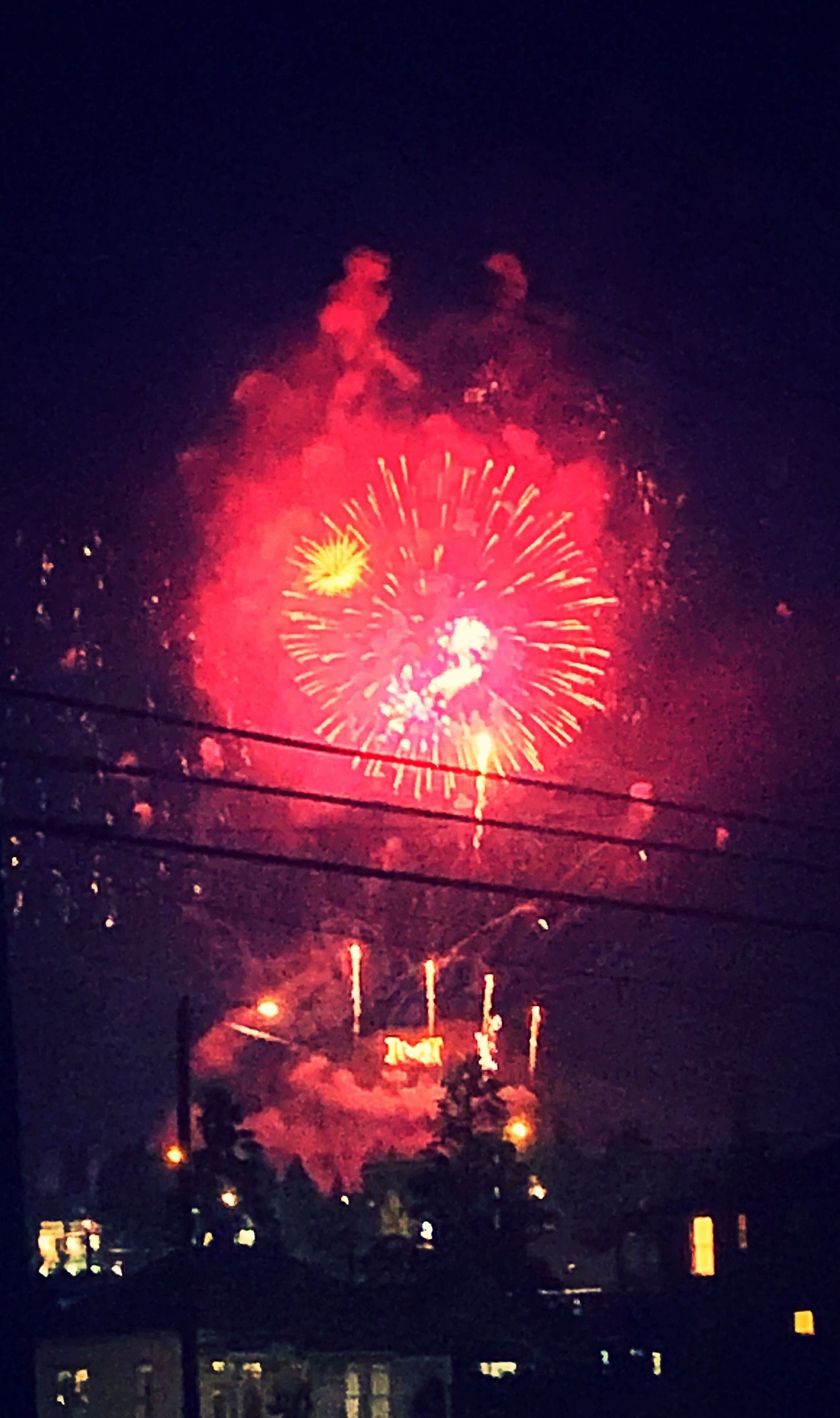 Fireworks exploding in the night sky over  Butte, MT