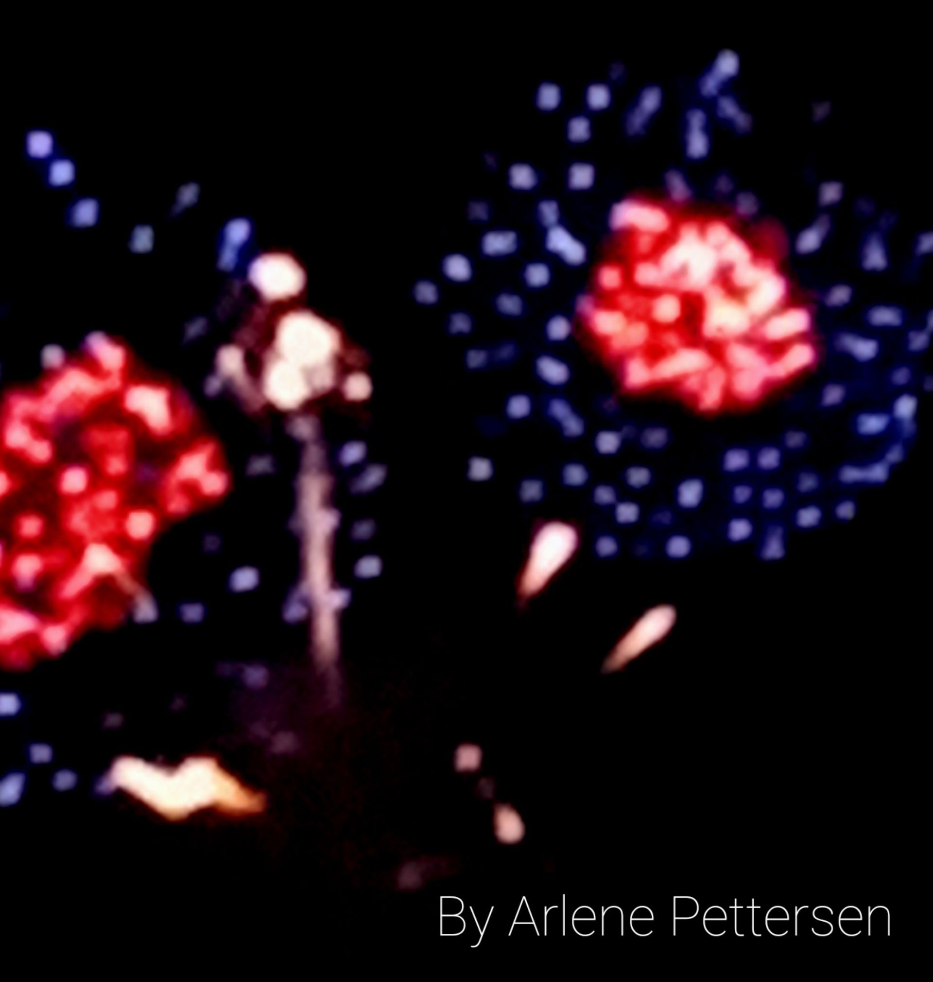 Fireworks exploding in the night sky over  Butte, MT