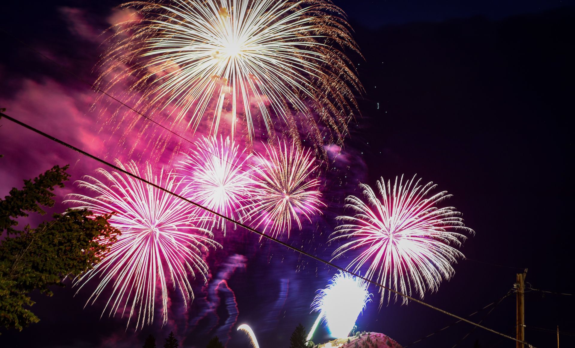 Fireworks exploding in the night sky over  Butte, MT