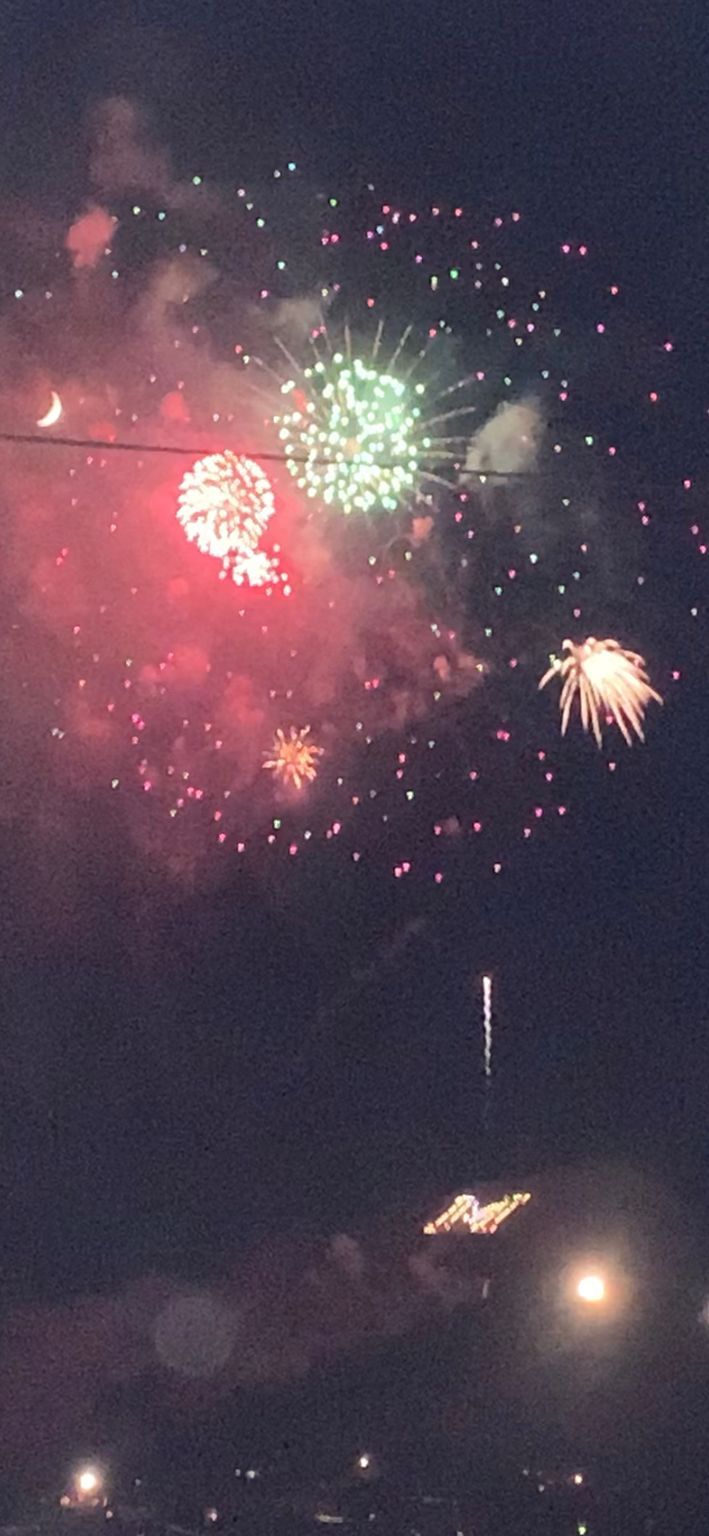 Fireworks exploding in the night sky over  Butte, MT