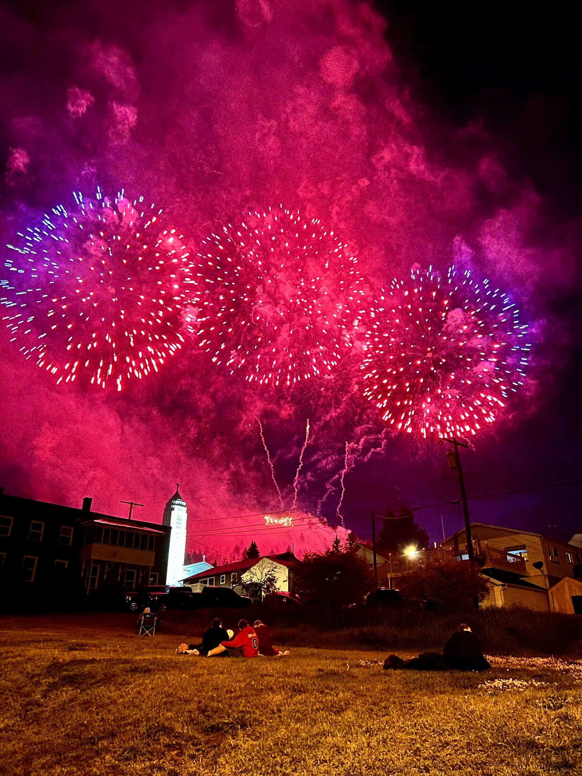 Fireworks exploding in the night sky over  Butte, MT