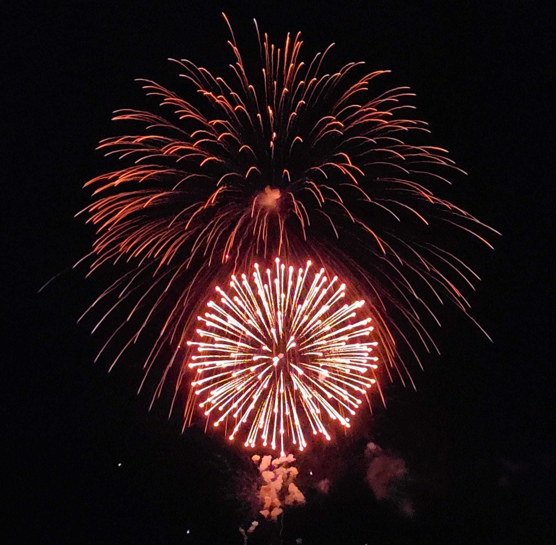 Fireworks exploding in the night sky over  Butte, MT