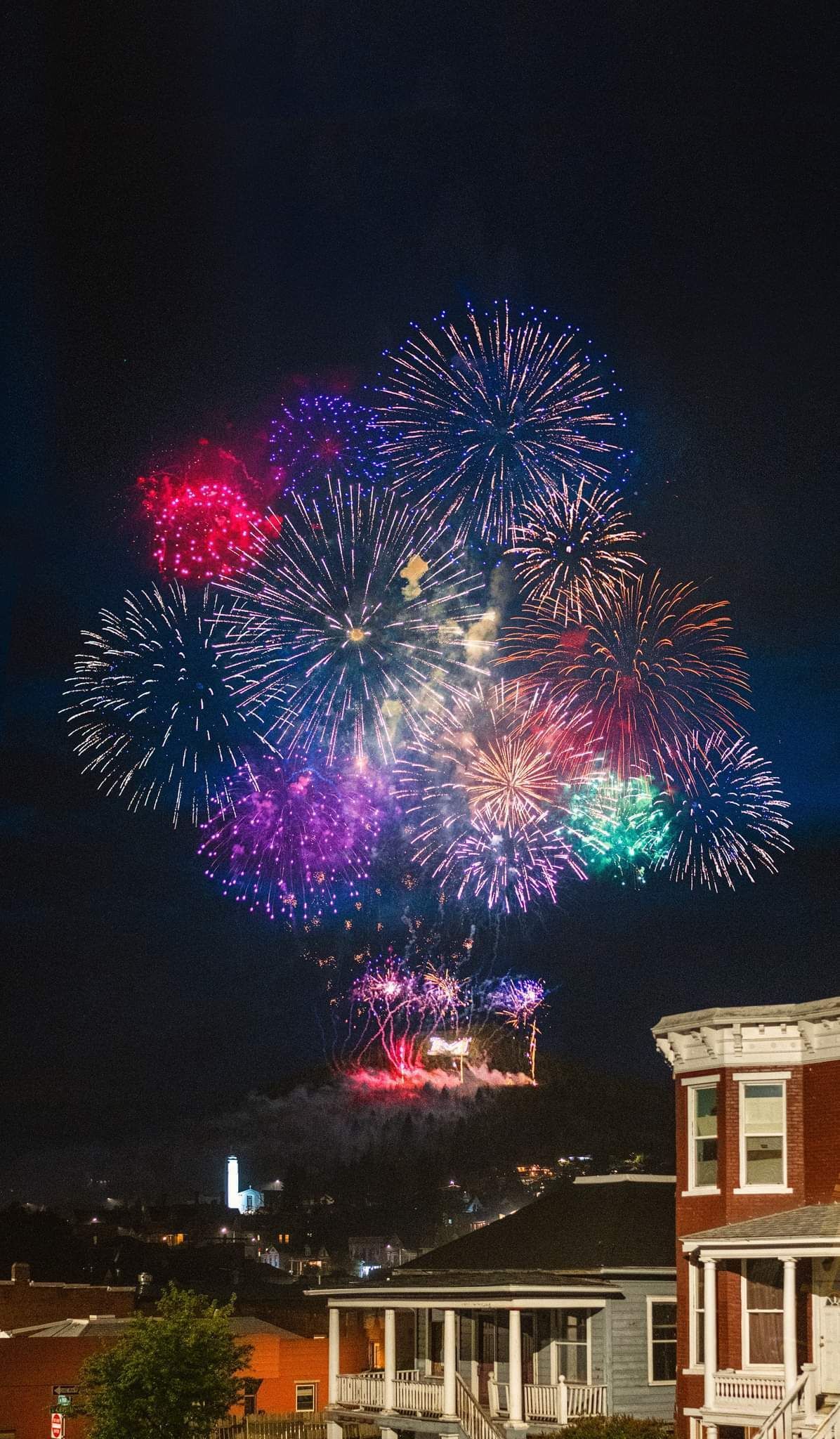 Fireworks exploding in the night sky over  Butte, MT