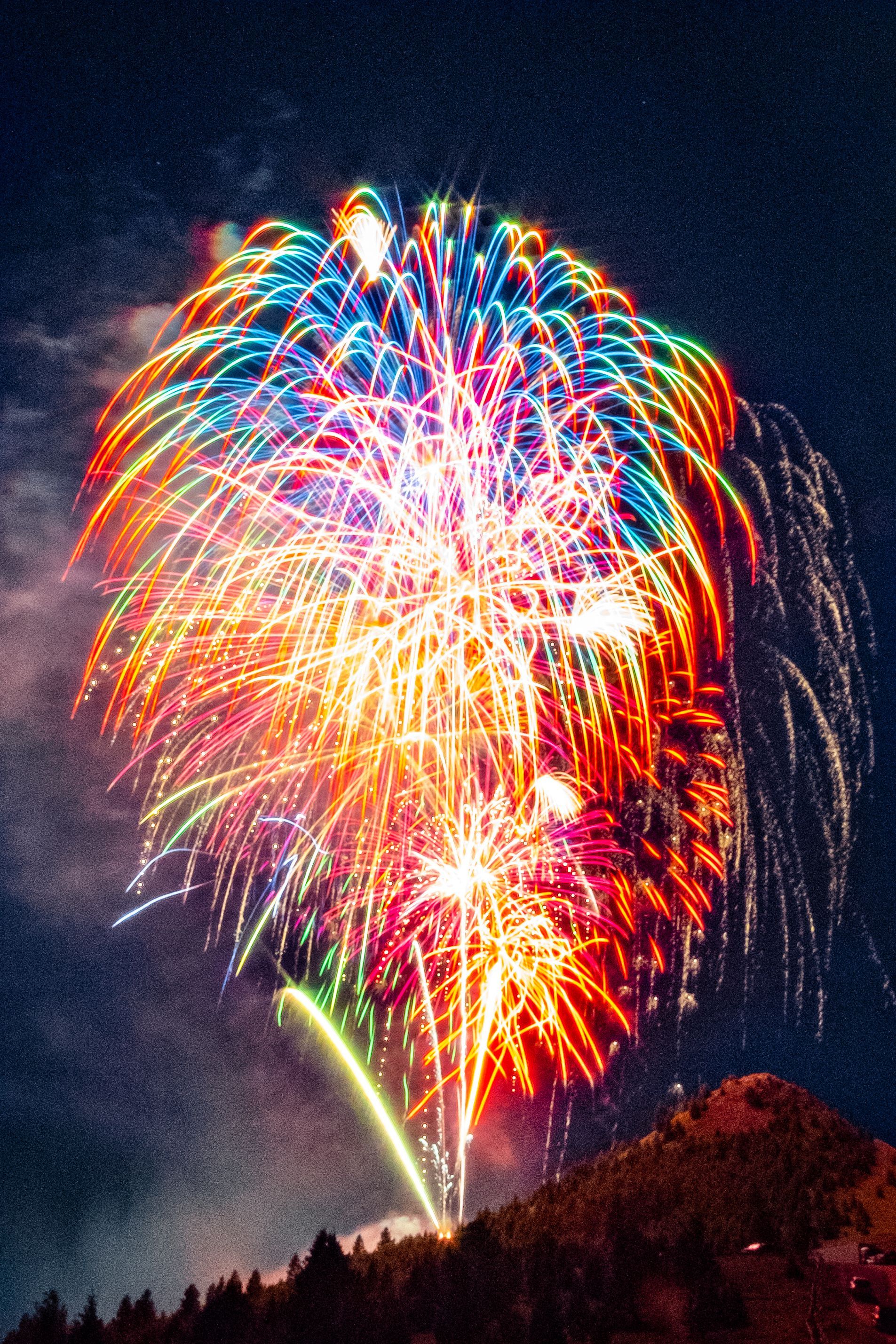 Fireworks exploding in the night sky over  Butte, MT