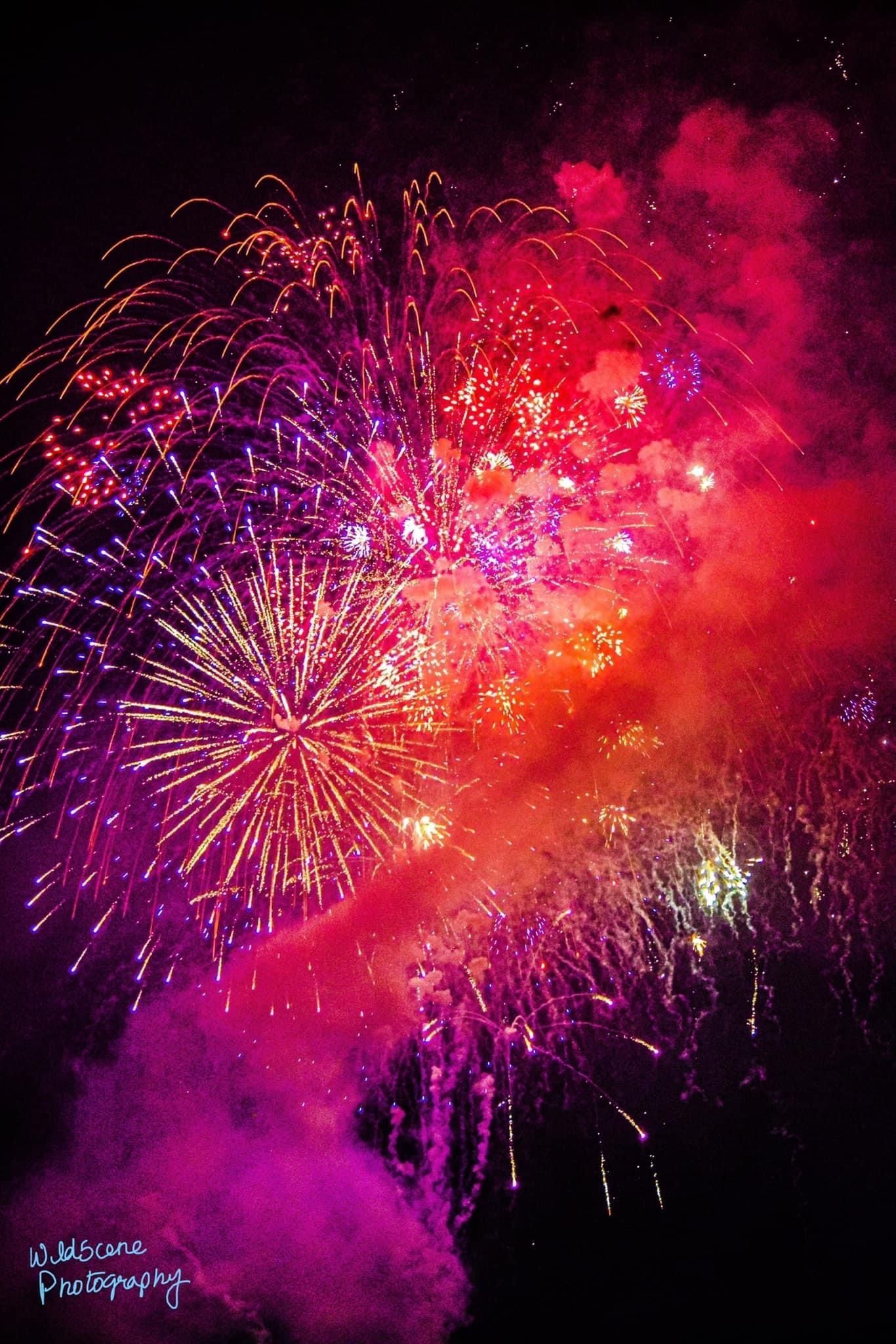 Fireworks exploding in the night sky over  Butte, MT