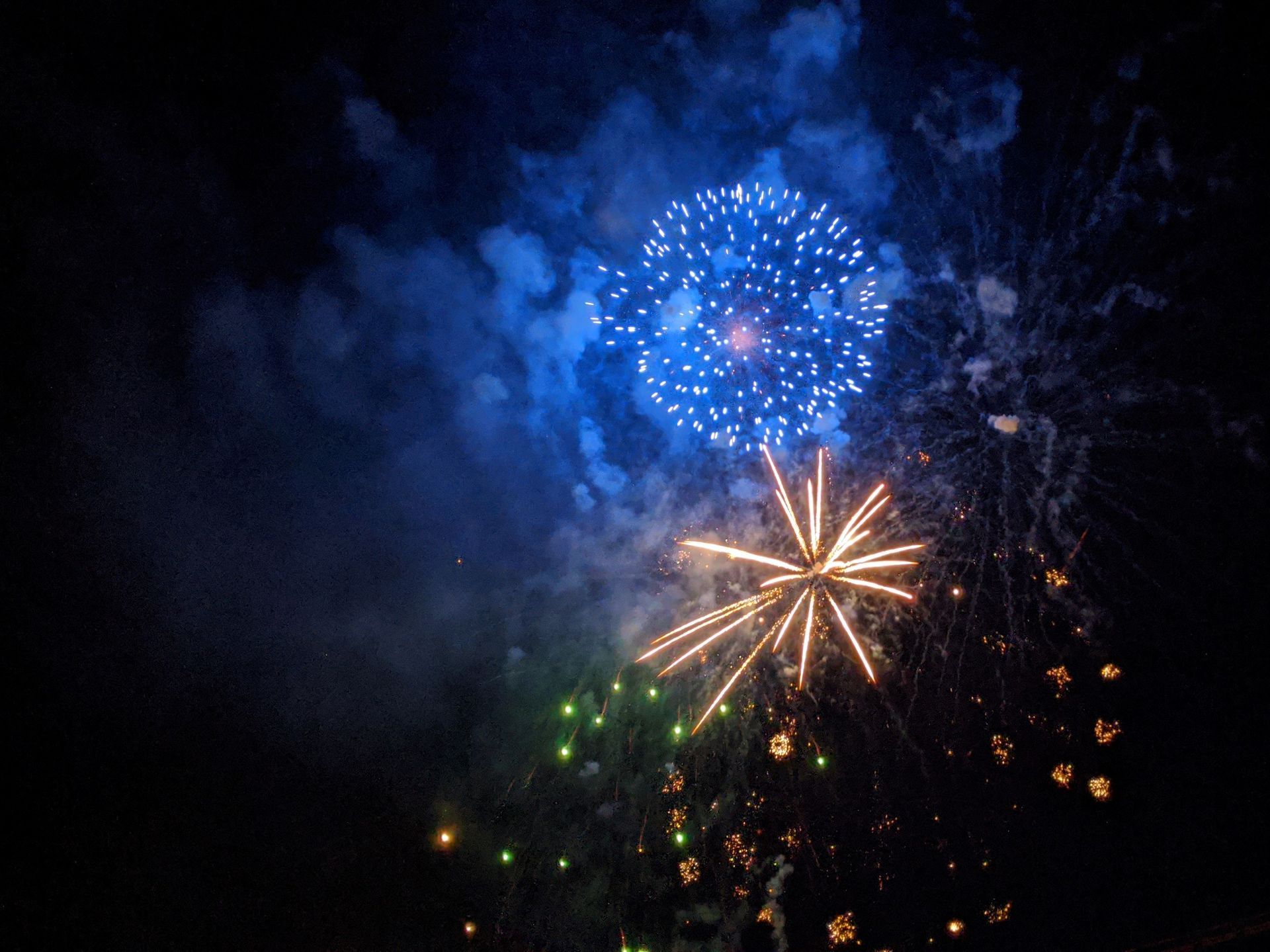 Fireworks exploding in the night sky over  Butte, MT