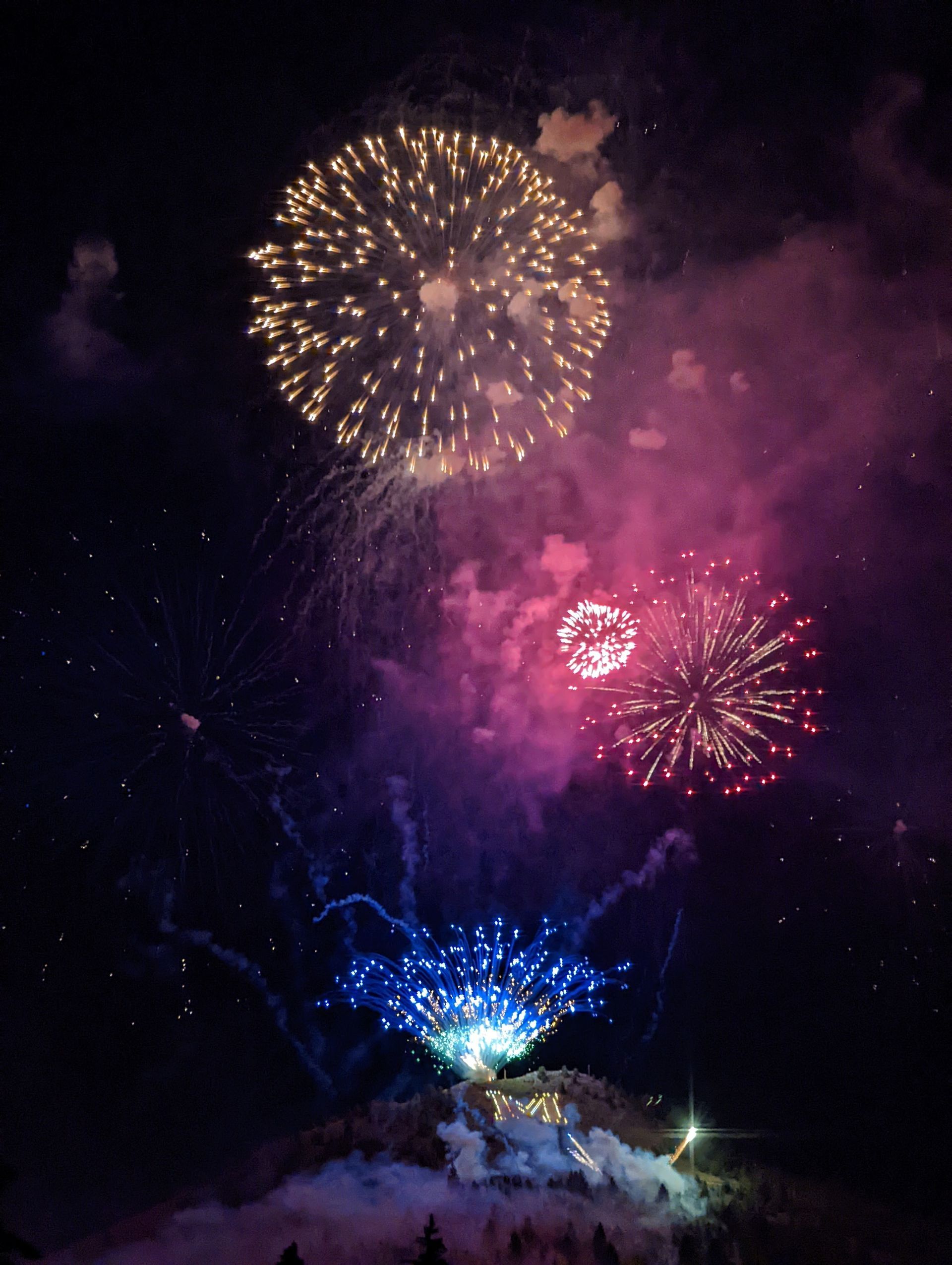 Fireworks exploding in the night sky over  Butte, MT