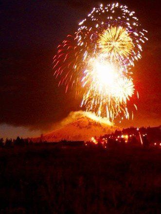 Jesse Nichols Fireworks exploding in the night sky over  Butte, MT