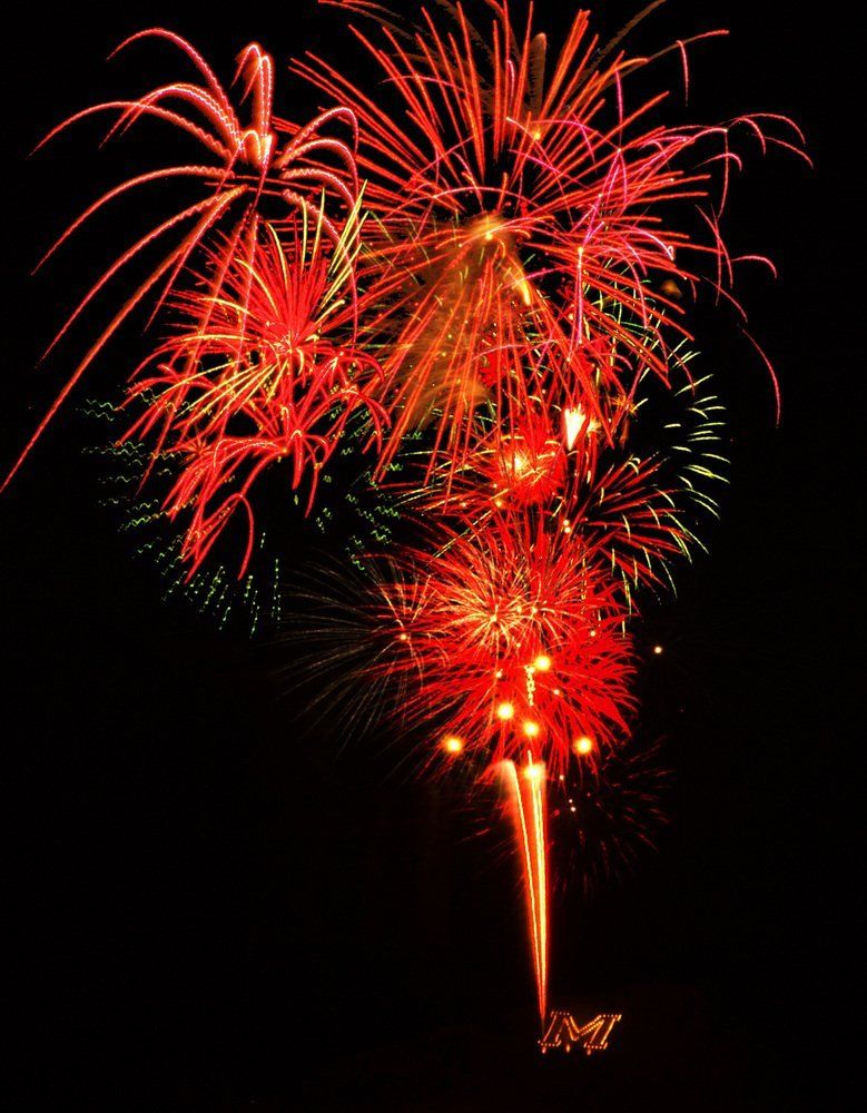 Brandon Rau Fireworks exploding in the night sky over  Butte, MT