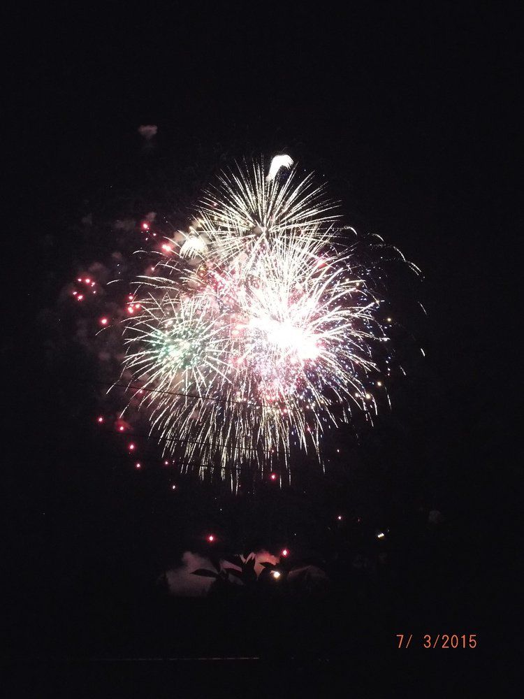 Angela Voss Fireworks exploding in the night sky over  Butte, MT
