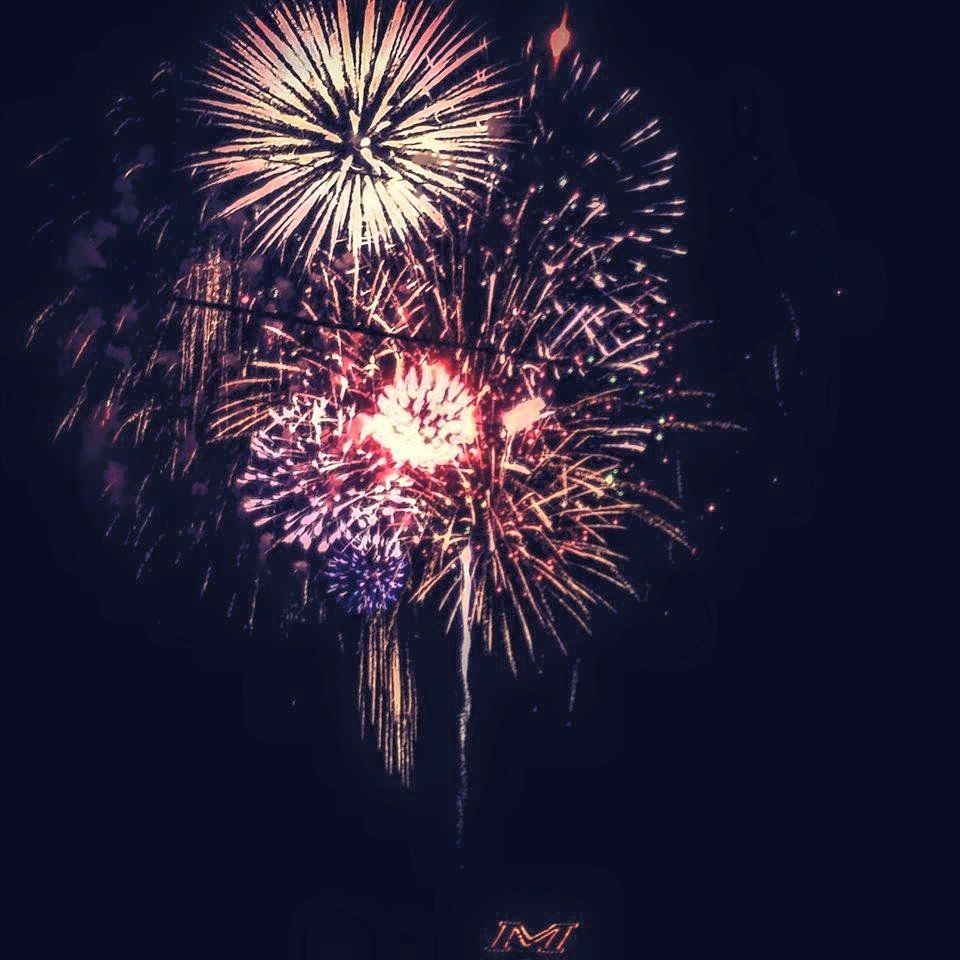 Kristina Martin Fireworks exploding in the night sky over  Butte, MT