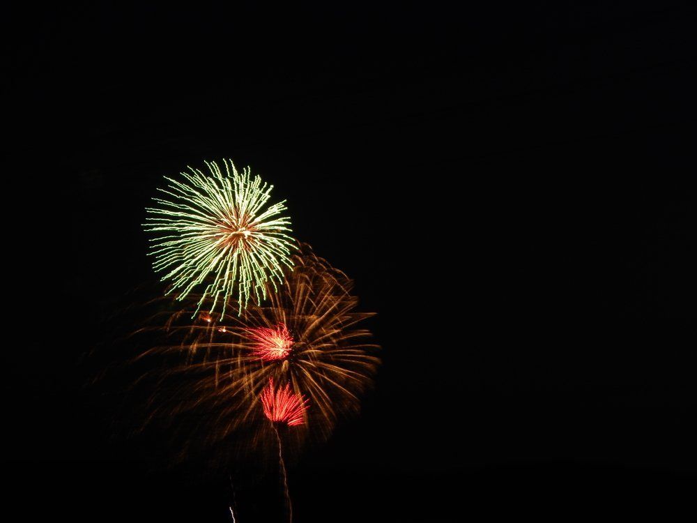 Griffin Brasher Fireworks exploding in the night sky over  Butte, MT