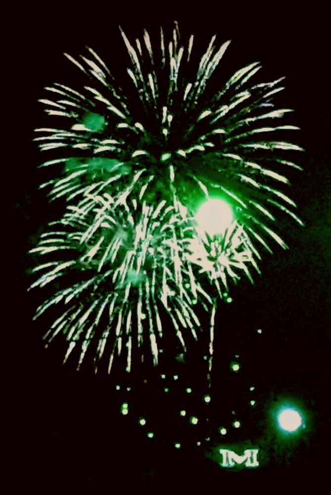 Angellia Melby Fireworks exploding in the night sky over  Butte, MT
