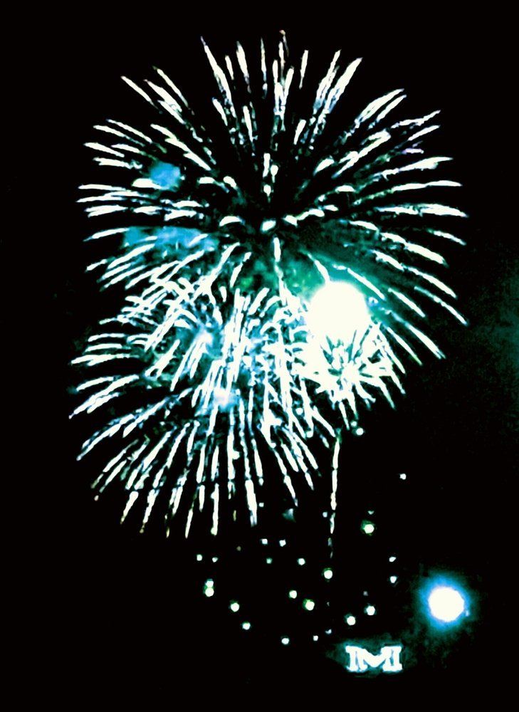Angellia Melby Fireworks exploding in the night sky over  Butte, MT