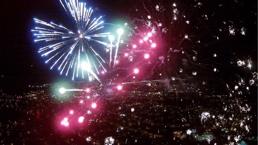 Aldo Vesco Fireworks exploding in the night sky over  Butte, MT