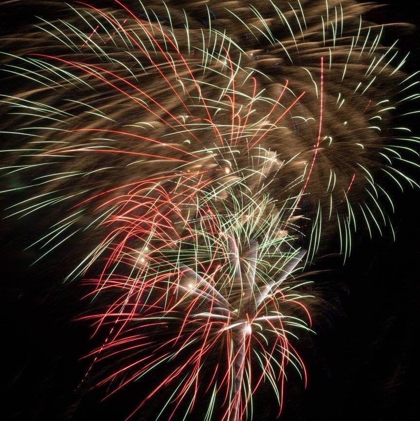 Karolee Larson Fireworks exploding in the night sky over  Butte, MT