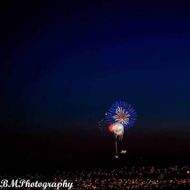 Bryan McConnaha Fireworks exploding in the night sky over  Butte, MT