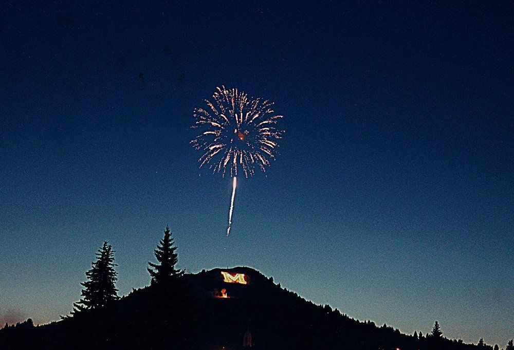 Karen Andreas Fireworks exploding in the night sky over  Butte, MT