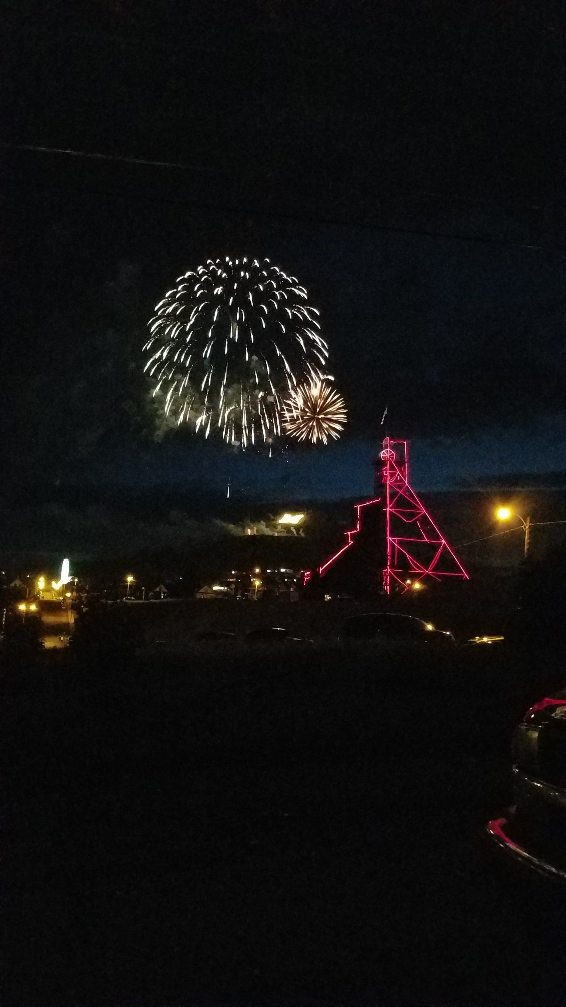 Fireworks exploding in the night sky over  Butte, MT