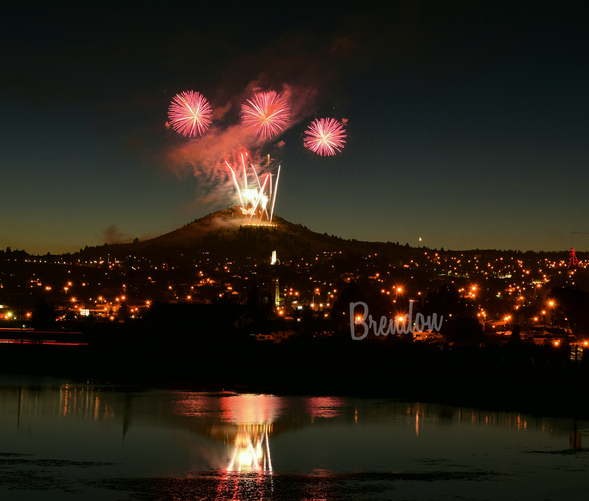 Fireworks exploding in the night sky over  Butte, MT