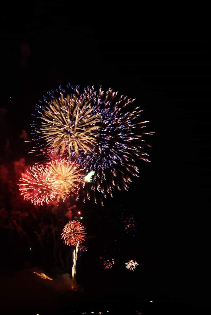 Fireworks exploding in the night sky over  Butte, MT