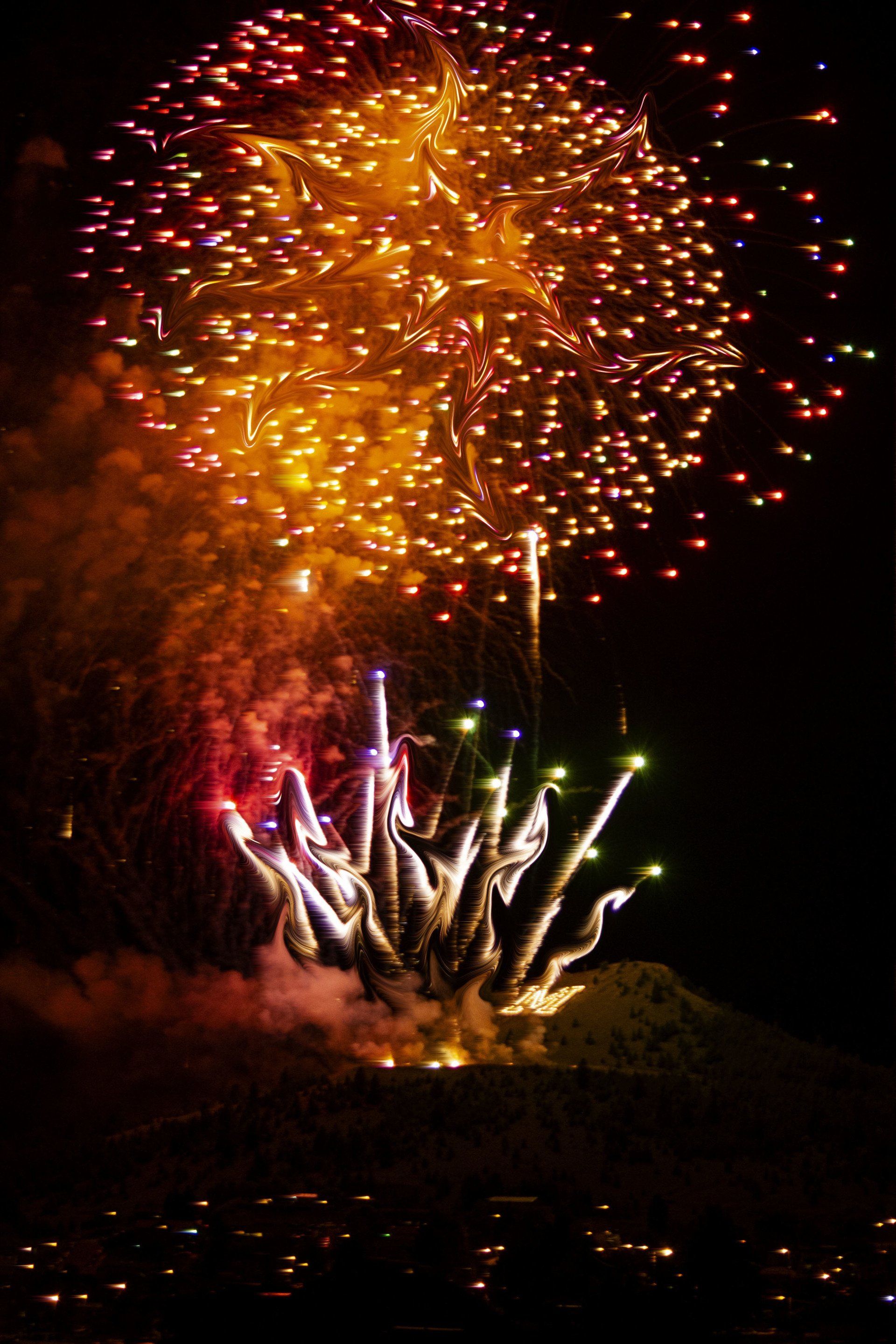 Fireworks exploding in the night sky over  Butte, MT