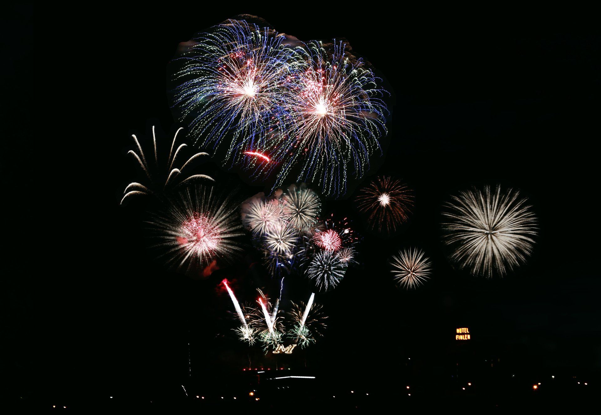 Fireworks exploding in the night sky over  Butte, MT