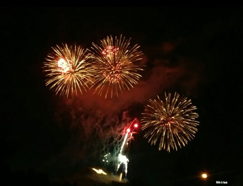Fireworks exploding in the night sky over  Butte, MT
