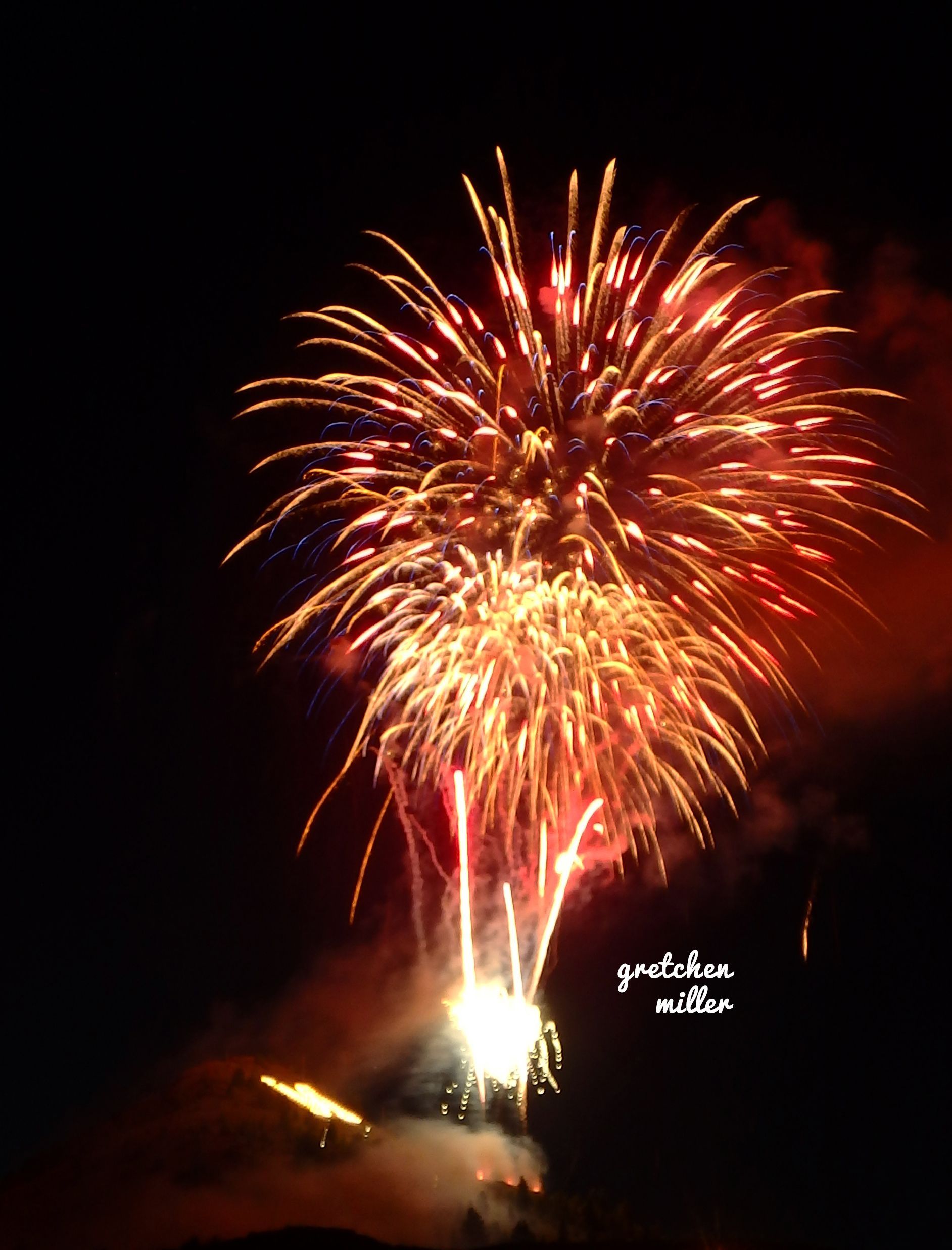 Fireworks exploding in the night sky over  Butte, MT