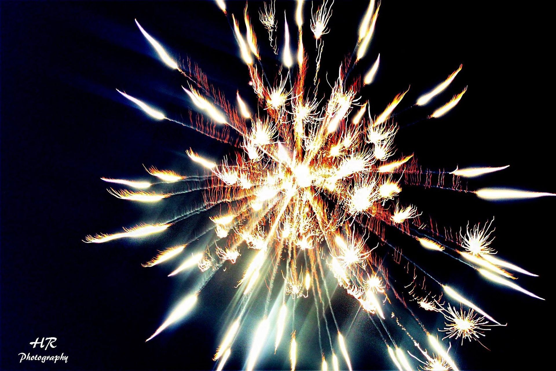Fireworks exploding in the night sky over  Butte, MT