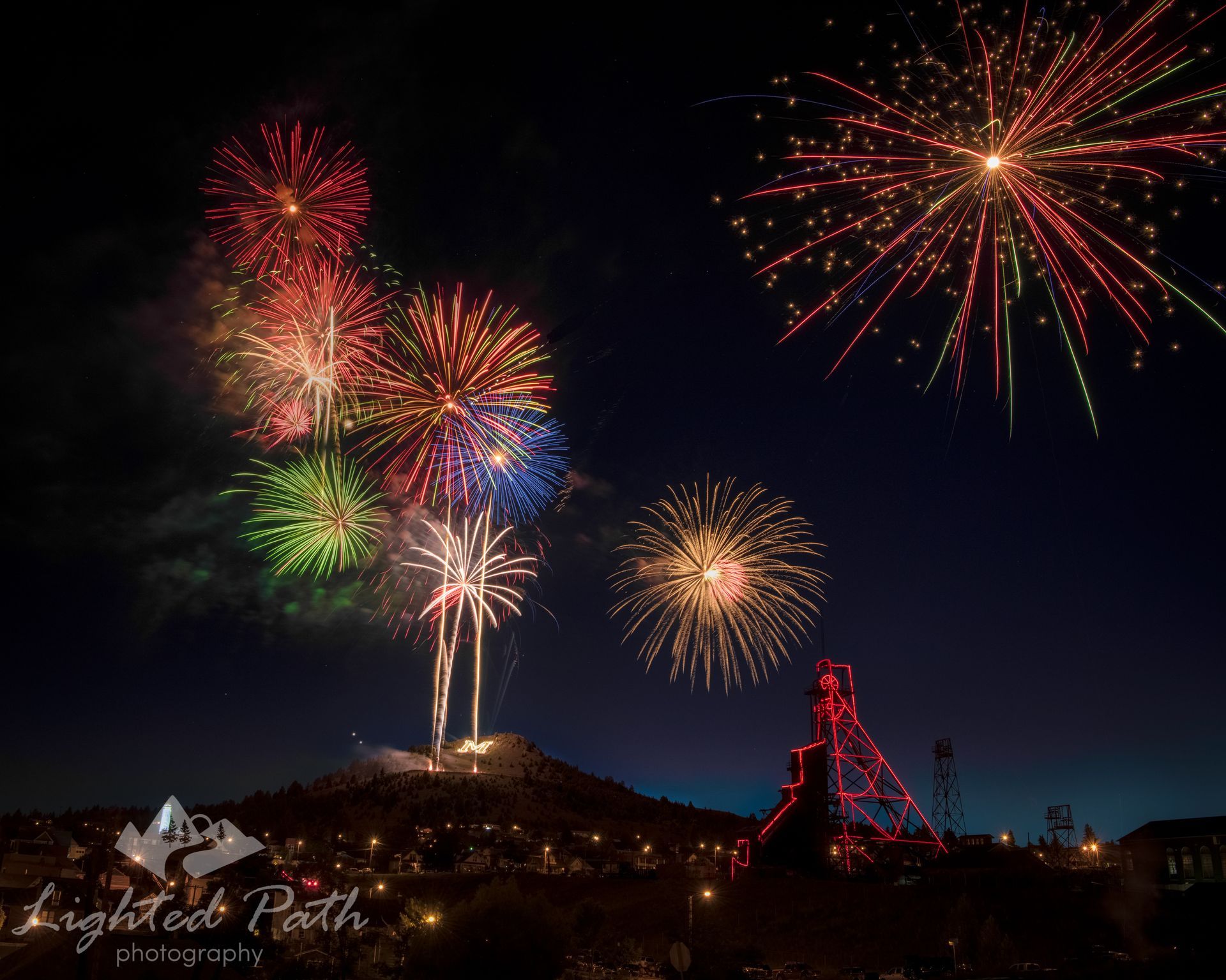 Fireworks exploding in the night sky over  Butte, MT