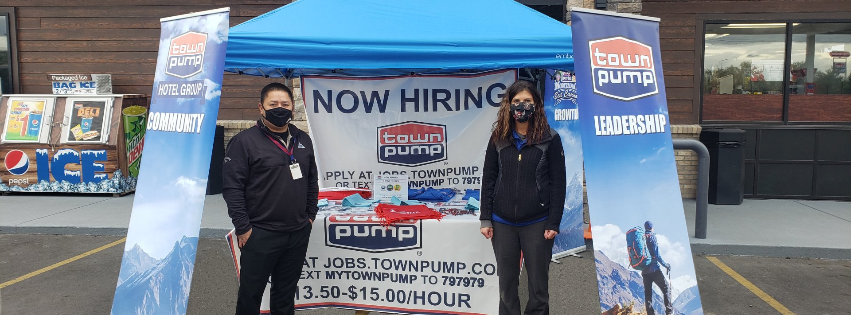 photo of 2 employees outside of a Town Pump location hosting a hiring event wearing face masks in October of 2020