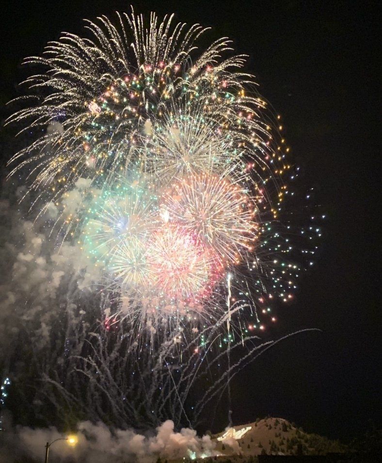 Fireworks exploding in the night sky over  Butte, MT