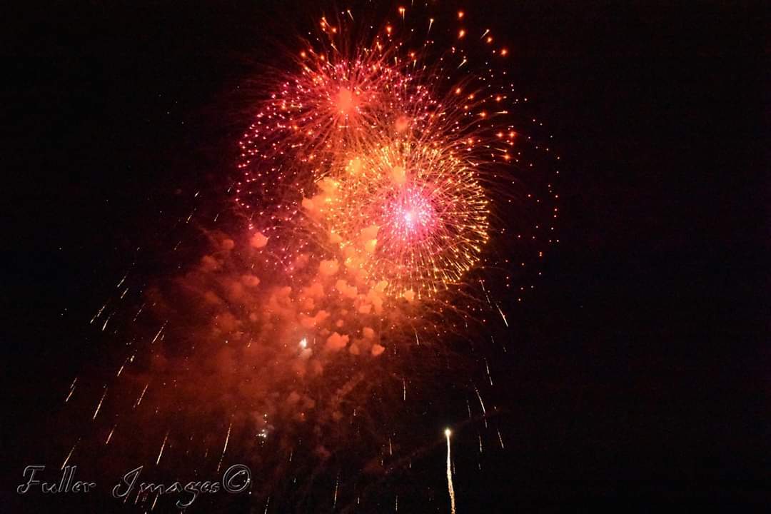 Fireworks exploding in the night sky over  Butte, MT