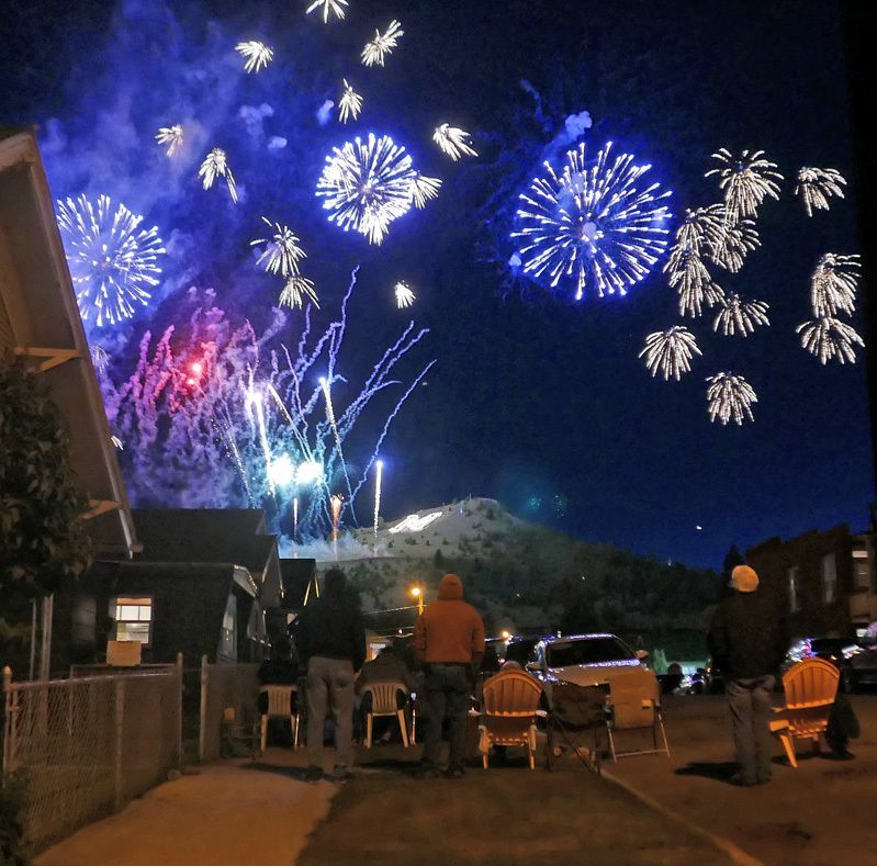 Fireworks exploding in the night sky over  Butte, MT