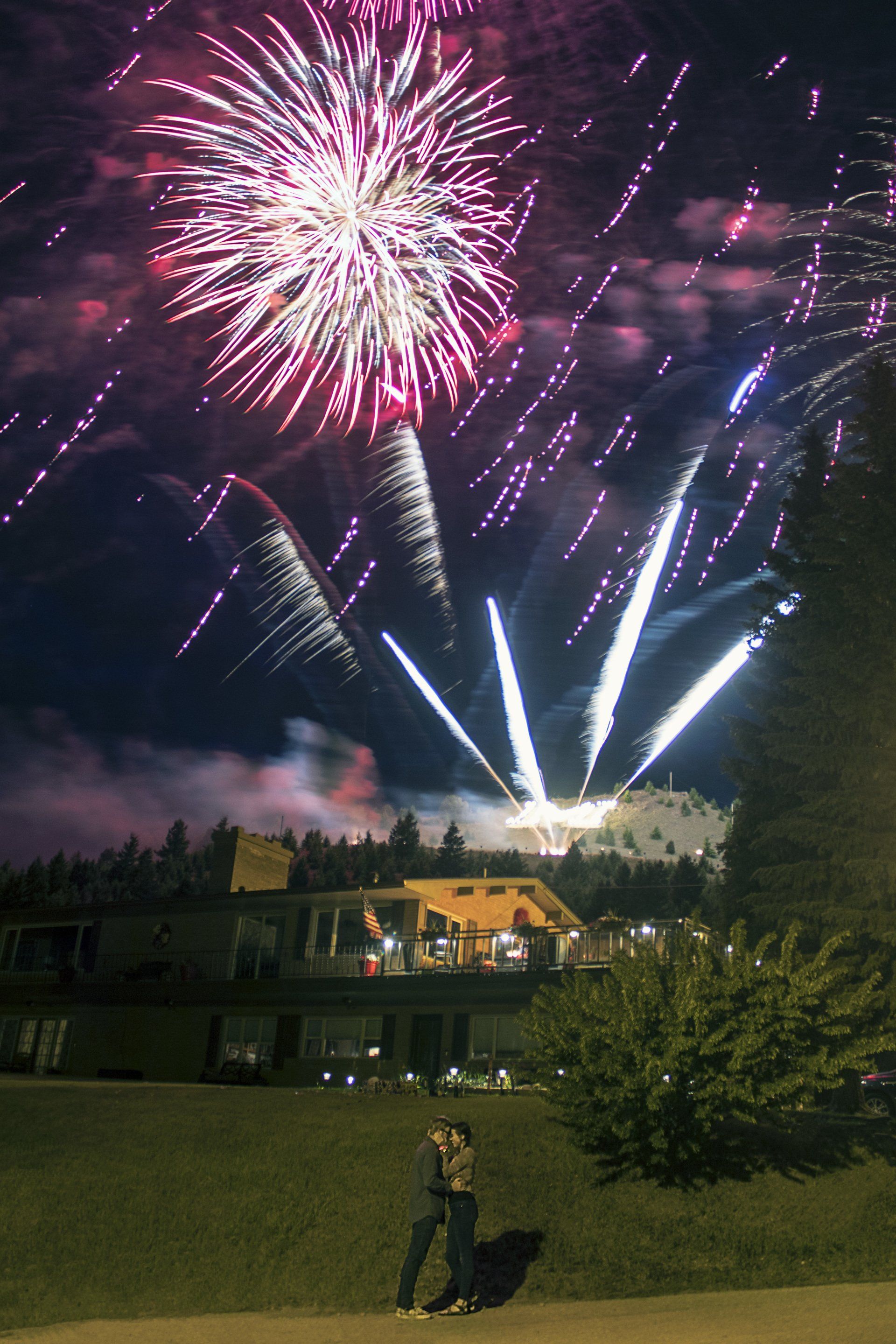 Fireworks exploding in the night sky over  Butte, MT