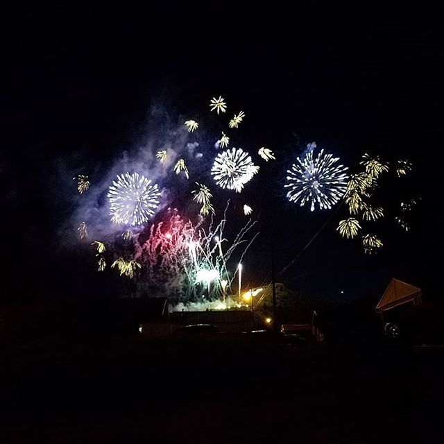 Fireworks exploding in the night sky over  Butte, MT
