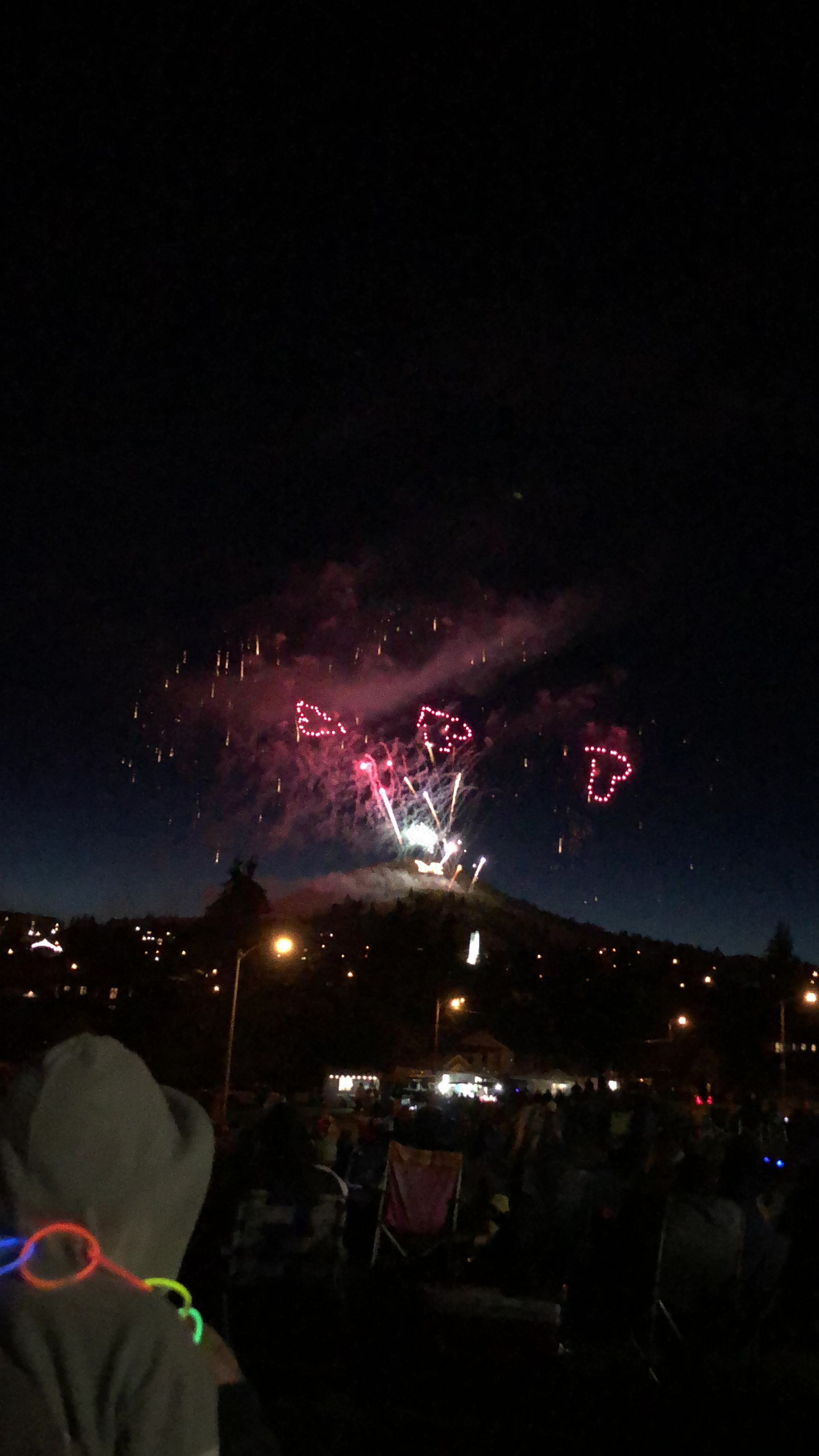 Fireworks exploding in the night sky over  Butte, MT
