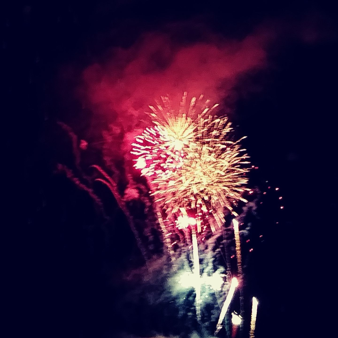 Fireworks exploding in the night sky over  Butte, MT