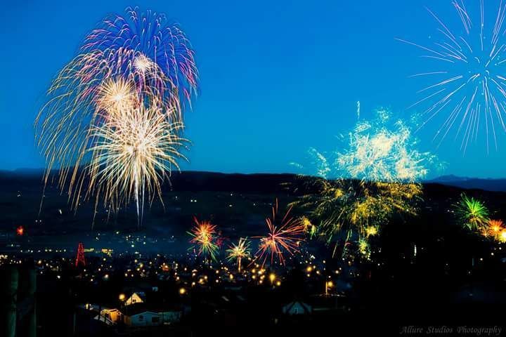 Fireworks exploding in the night sky over  Butte, MT