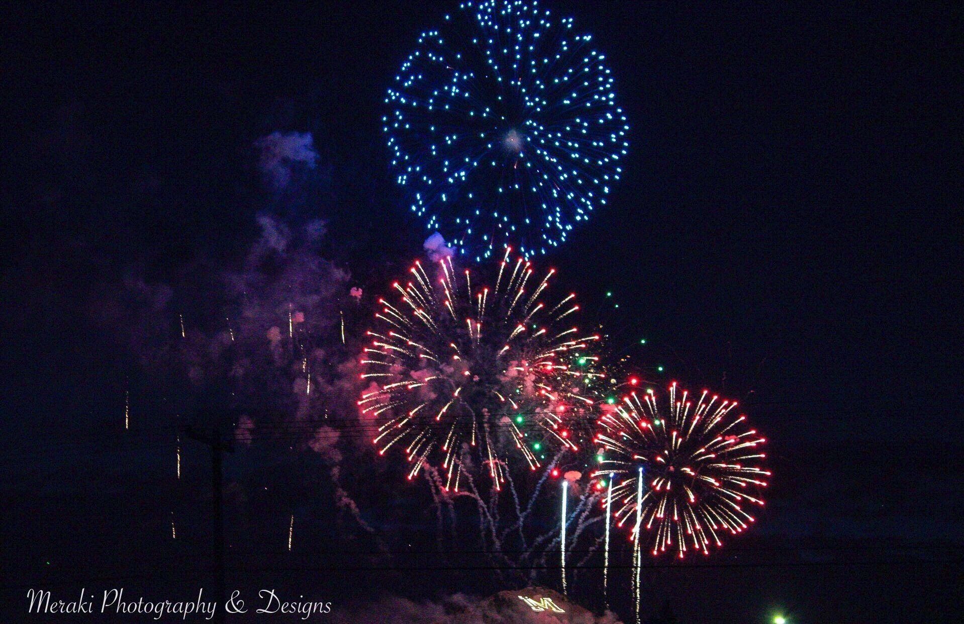 Fireworks exploding in the night sky over  Butte, MT