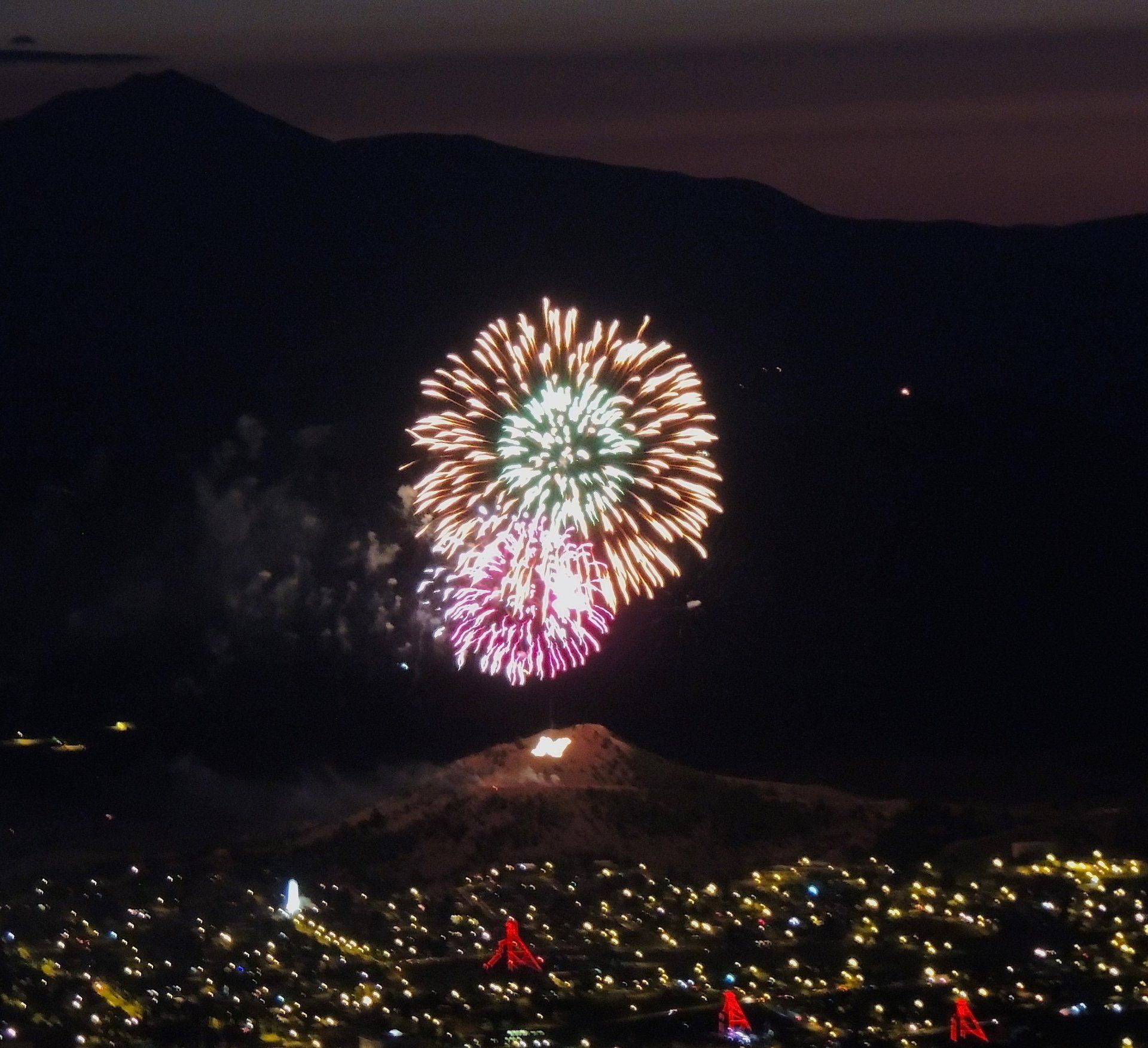 Fireworks exploding in the night sky over  Butte, MT