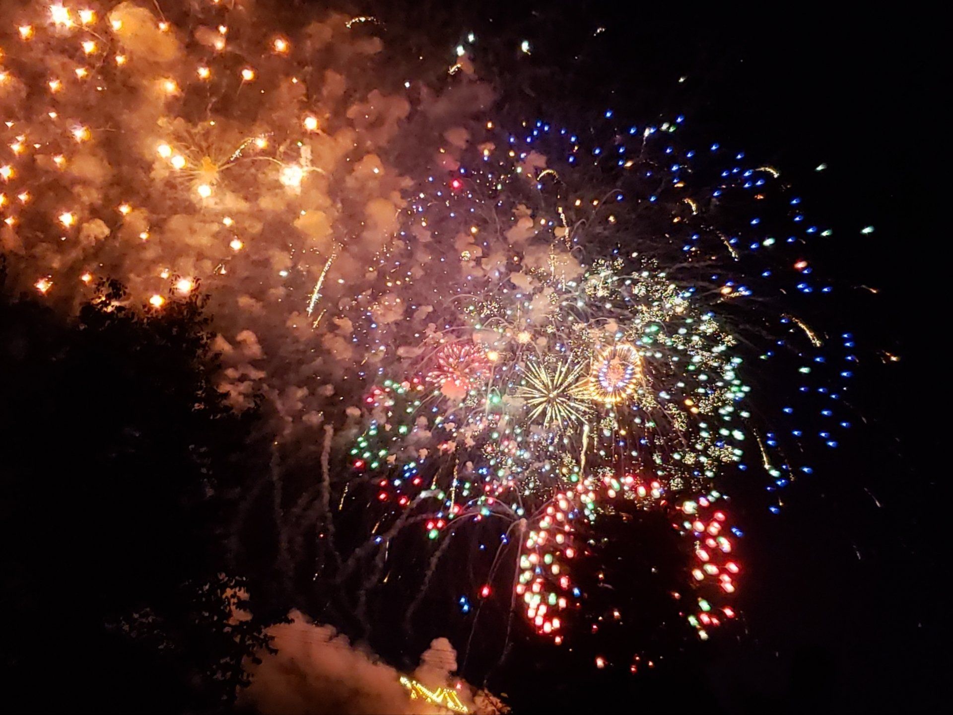 Fireworks exploding in the night sky over  Butte, MT